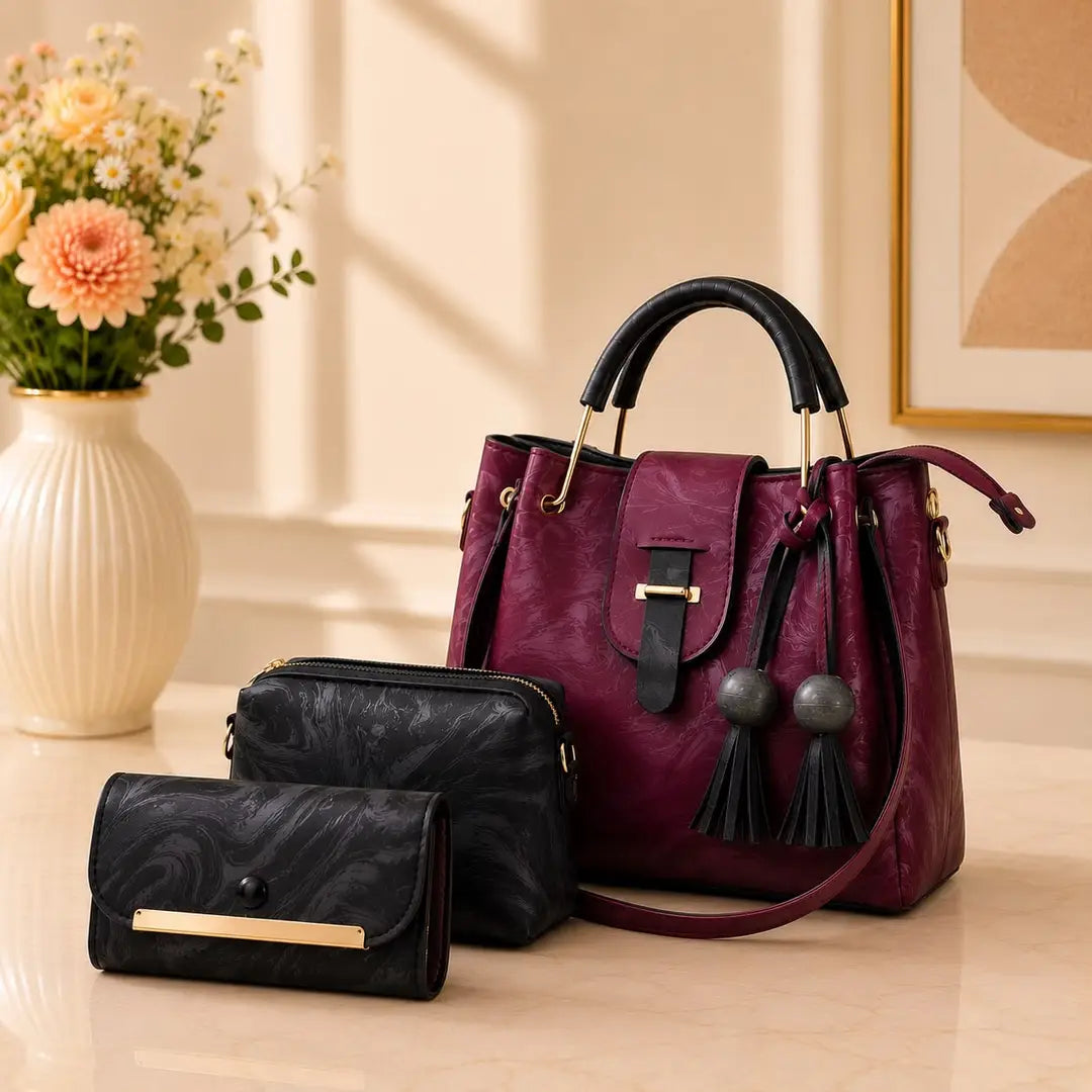 Women's maroon leather handbag with top handle